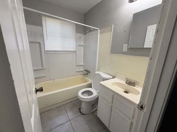a bathroom with a sink a toilet and a bathtub