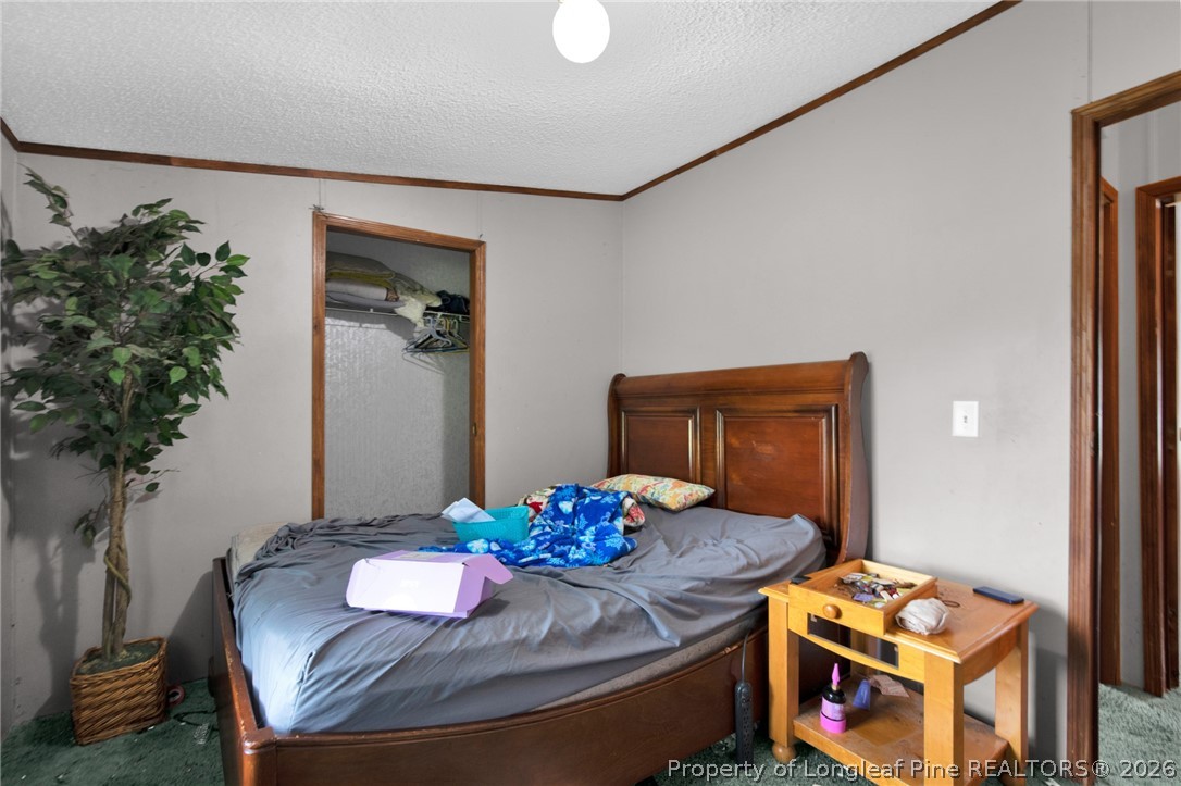 4705 Hickory Ridge Road Parkton, NC 28371 - Photo 29 of 37 a living room with furniture and flowers