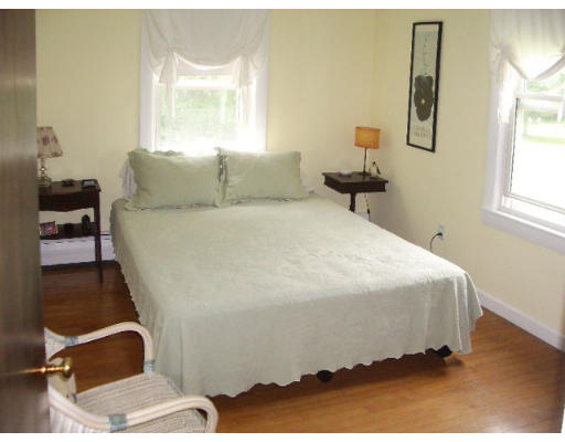 165 State Road Templeton, MA 01436 - Photo 7 of 9 a bedroom with a bed and wooden floor