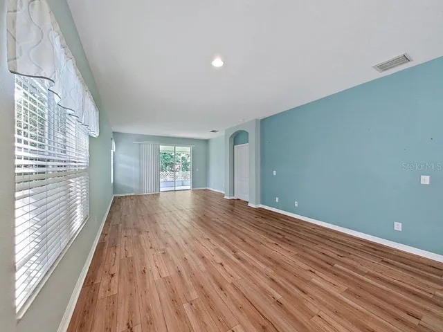 a view of a hallway with a washer and dryer