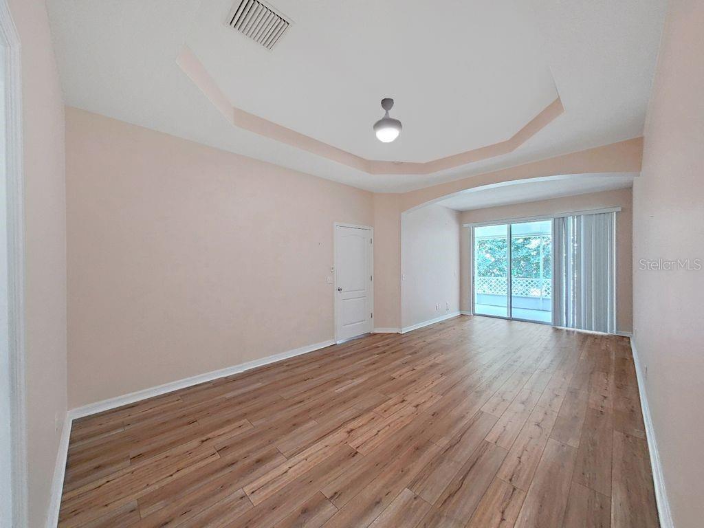 6077 Sandhill Ridge Drive Lithia, FL 33547 - Photo 20 of 58 wooden floor in an empty room with a window