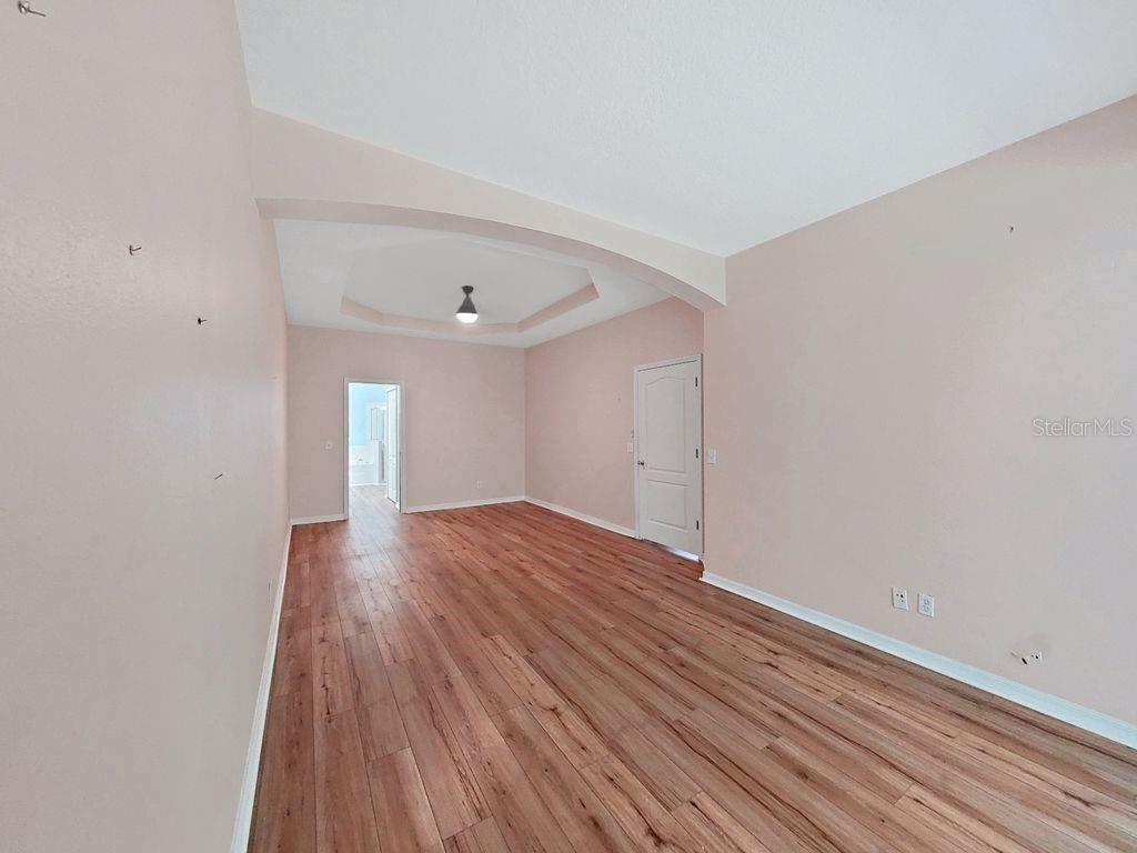 6077 Sandhill Ridge Drive Lithia, FL 33547 - Photo 21 of 58 a view of an empty room with wooden floor