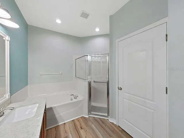 a view of an empty room with windows