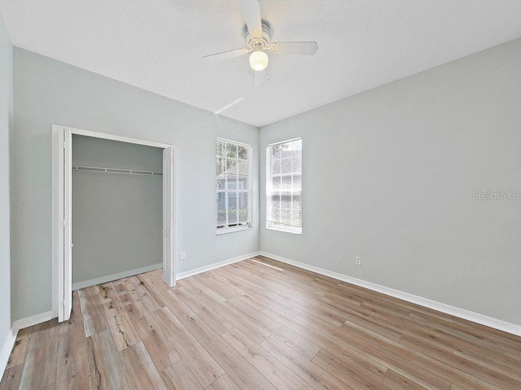 6077 Sandhill Ridge Drive Lithia, FL 33547 - Photo 30 of 58 wooden floor in an empty room with a window