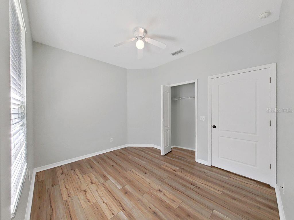 6077 Sandhill Ridge Drive Lithia, FL 33547 - Photo 32 of 58 a view of an empty room with wooden floor