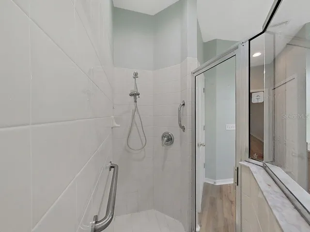 a view of a pathway with a tree