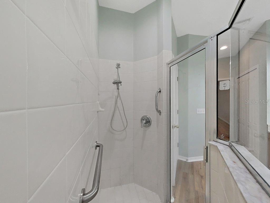 6077 Sandhill Ridge Drive Lithia, FL 33547 - Photo 33 of 58 a bathroom with a shower