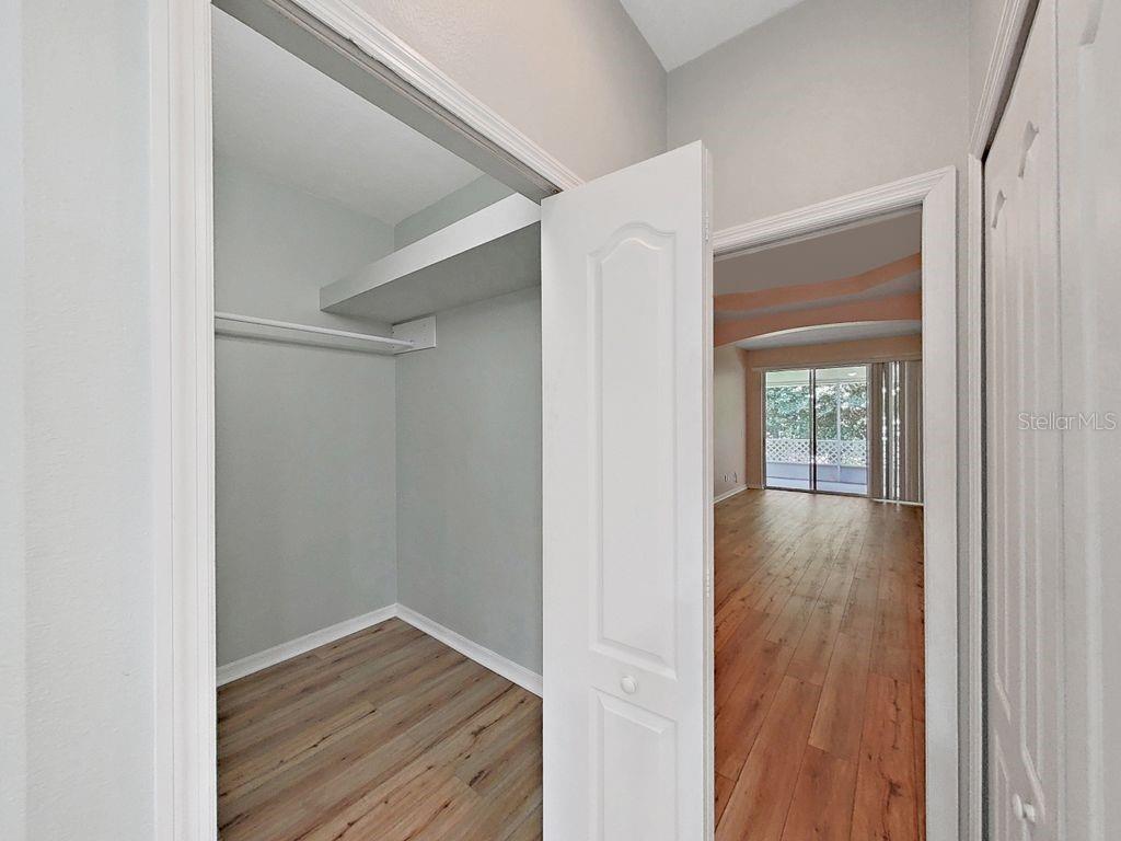 6077 Sandhill Ridge Drive Lithia, FL 33547 - Photo 34 of 58 a view of an empty room with wooden floor and a window