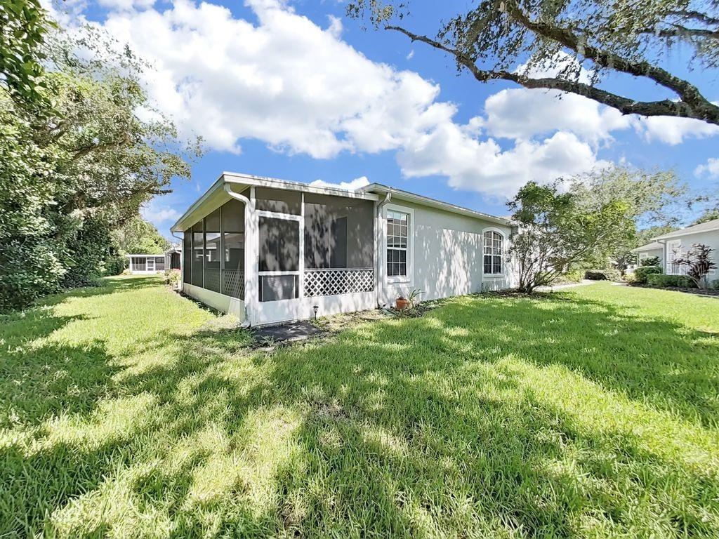 6077 Sandhill Ridge Drive Lithia, FL 33547 - Photo 38 of 58 a view of a house with yard and sitting area