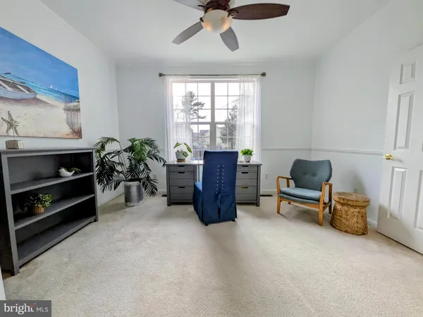 a bed room with furniture and a window