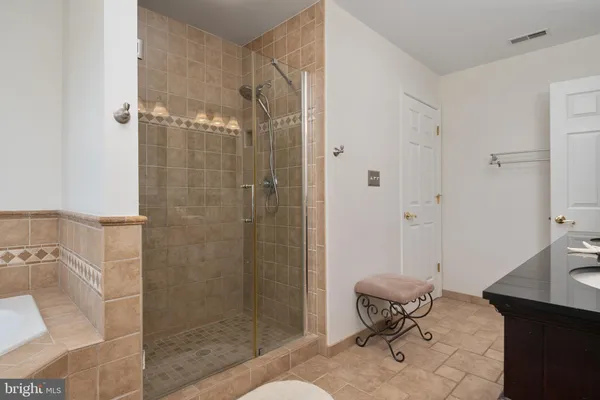 a bathroom with a shower toilet and sink