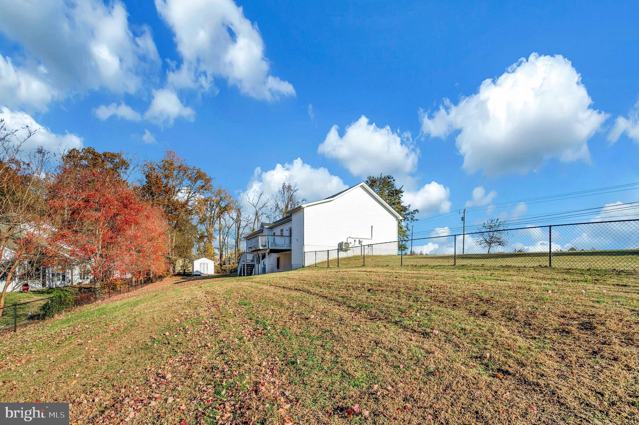 773 Truslow Road Fredericksburg, VA 22406 - Photo 12 of 63 a view of a big yard with table and chairs and a fire pit