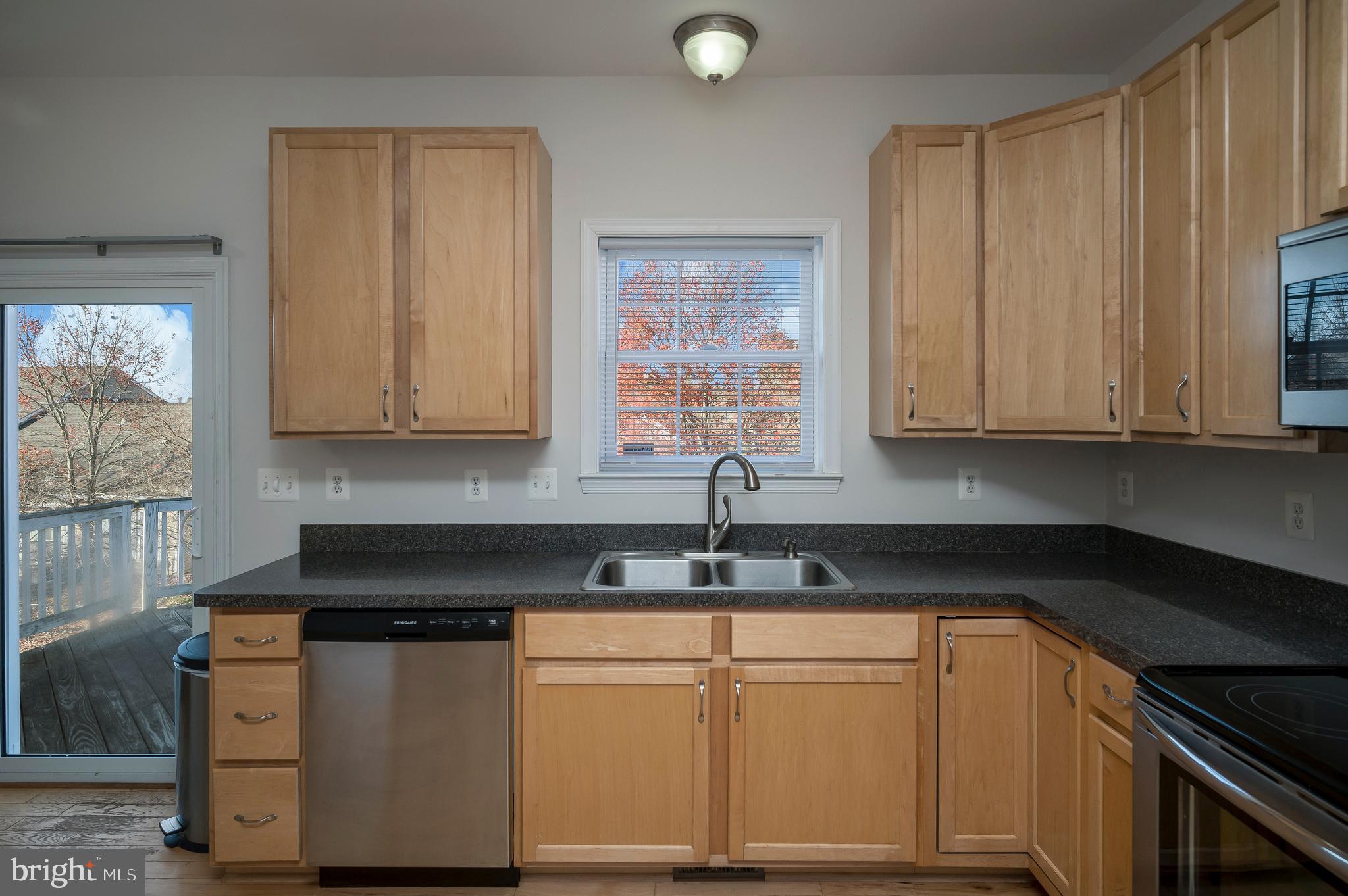 773 Truslow Road Fredericksburg, VA 22406 - Photo 26 of 63 a kitchen with granite countertop white cabinets and sink