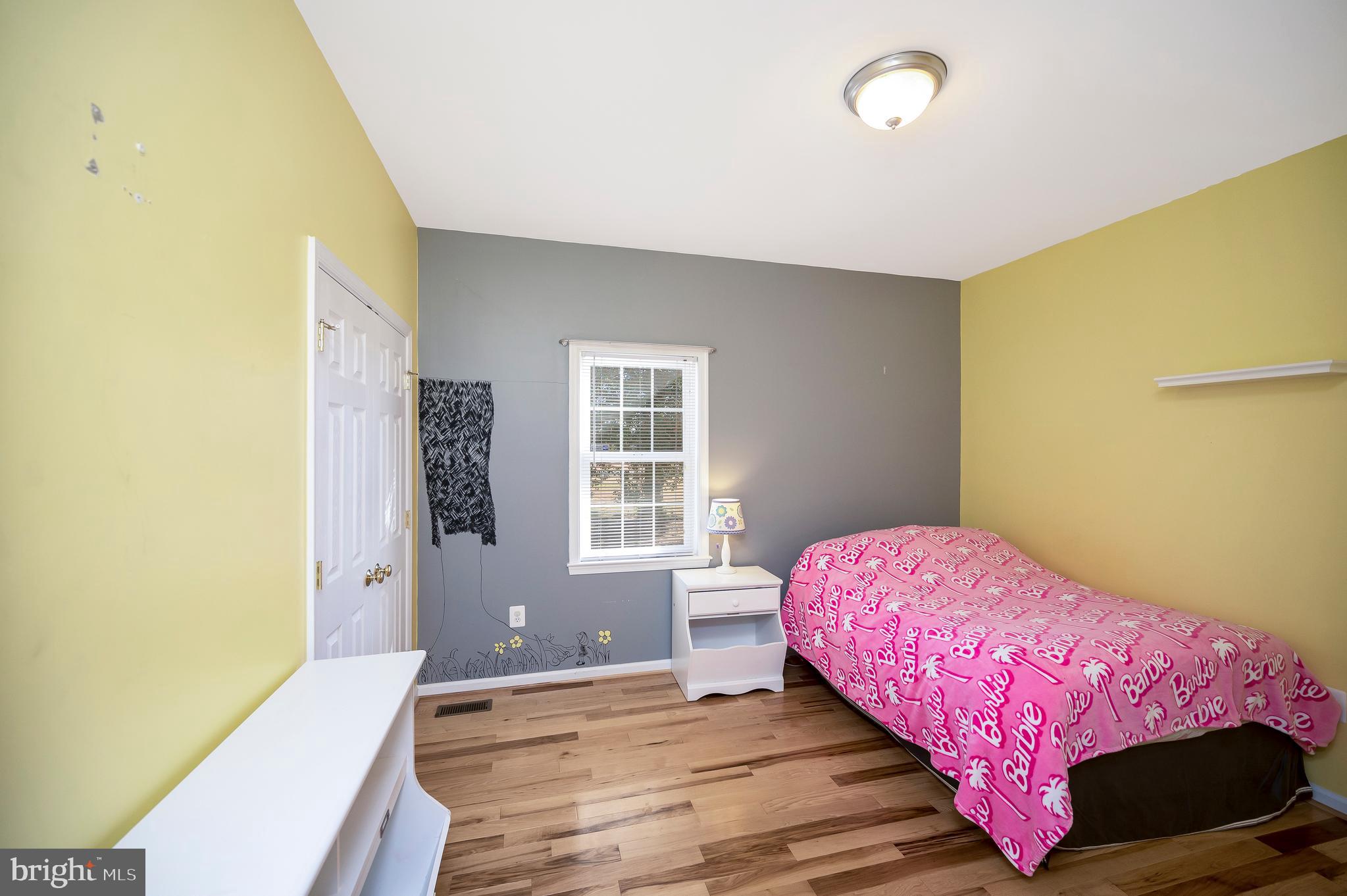 773 Truslow Road Fredericksburg, VA 22406 - Photo 37 of 63 a bedroom with a bed and wooden floor