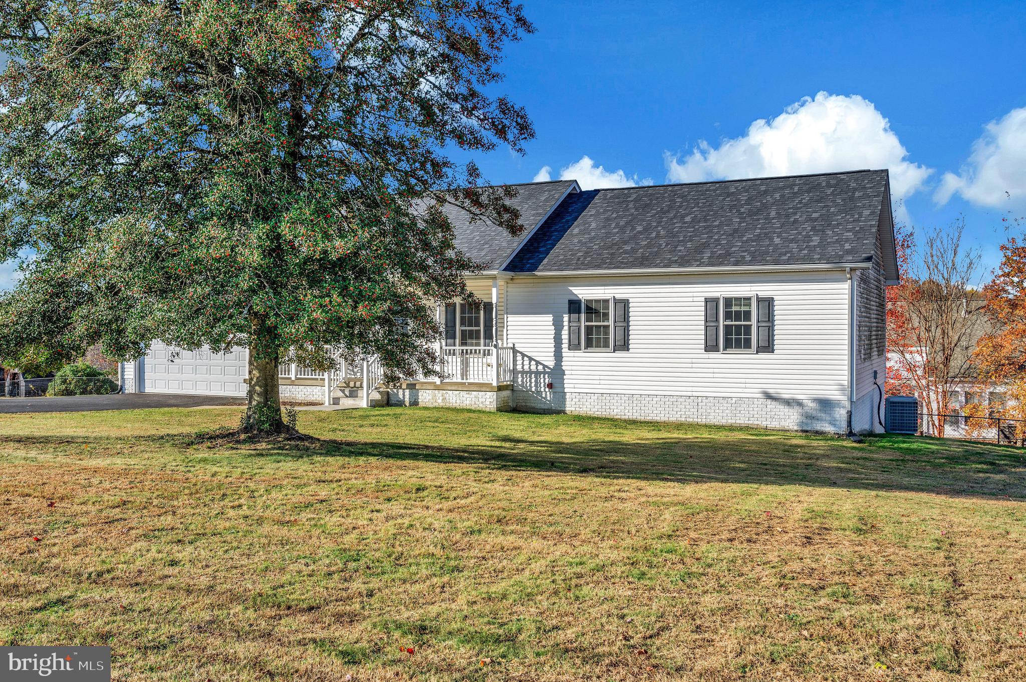 773 Truslow Road Fredericksburg, VA 22406 - Photo 4 of 63 a front view of a house with a garden