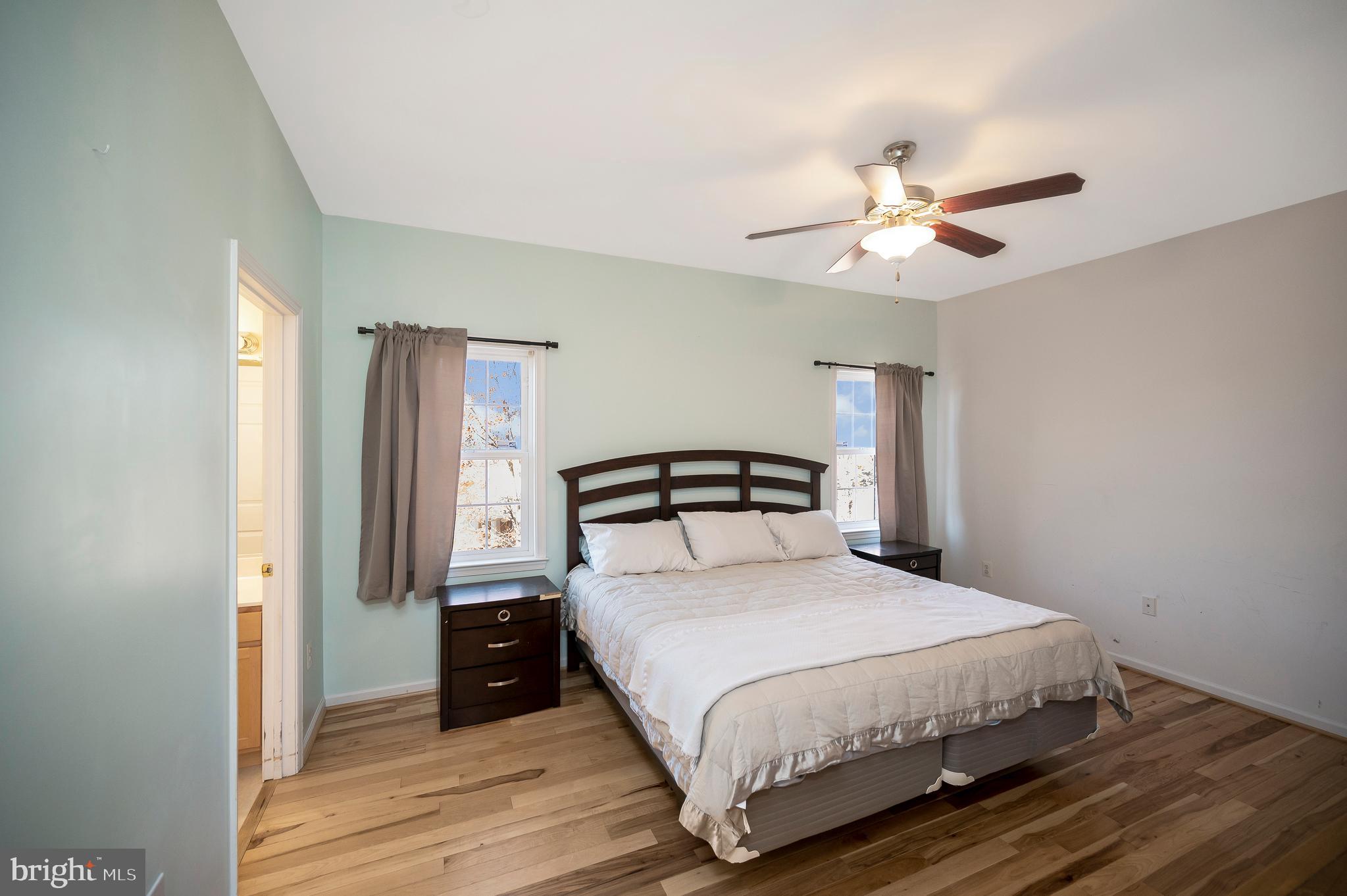 773 Truslow Road Fredericksburg, VA 22406 - Photo 41 of 63 a bedroom with a bed and a chandelier