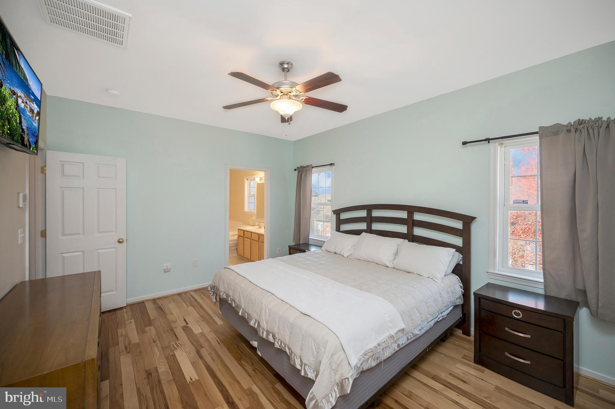 773 Truslow Road Fredericksburg, VA 22406 - Photo 43 of 63 a bedroom with a bed and a chandelier