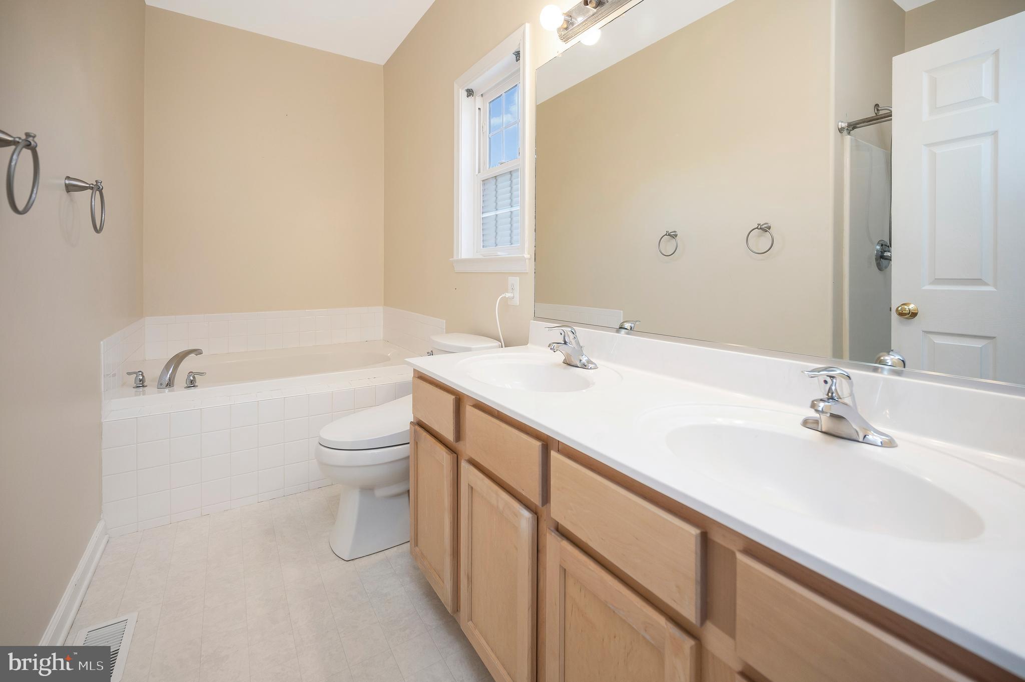 773 Truslow Road Fredericksburg, VA 22406 - Photo 45 of 63 a bathroom with a sink a toilet and shower