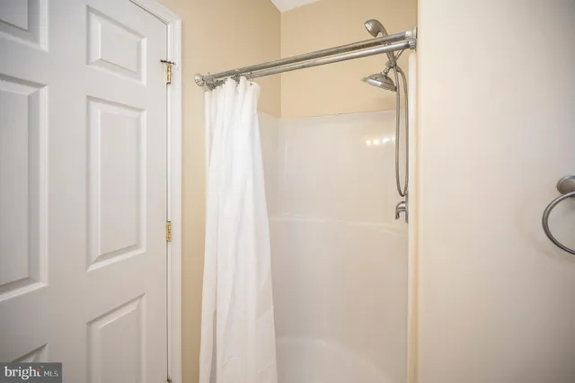 a view of a big room with a refrigerator and a car