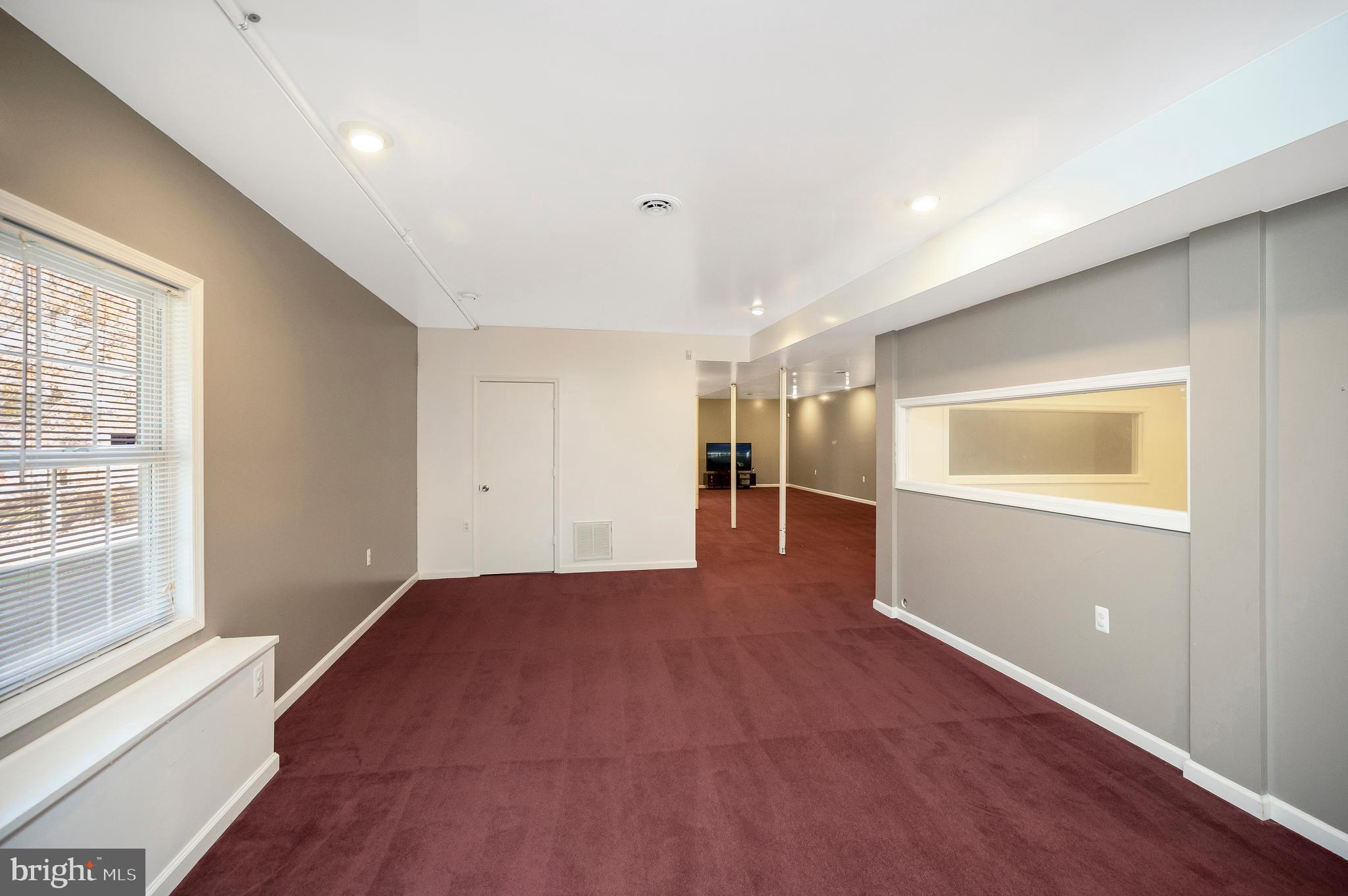 773 Truslow Road Fredericksburg, VA 22406 - Photo 50 of 63 a view of an empty room with wooden floor and a window