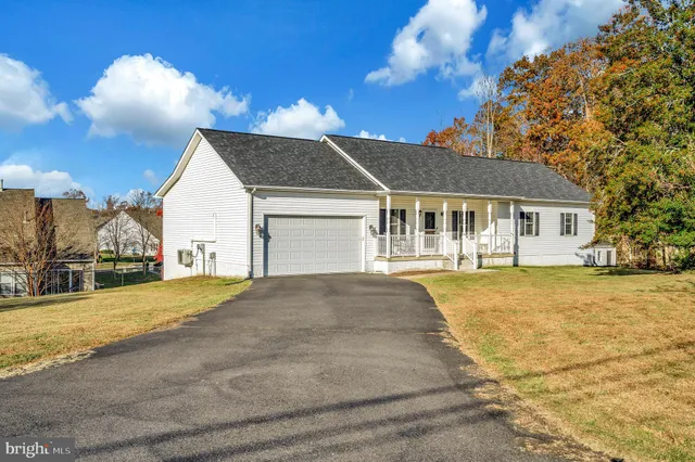 a view of a house next to a yard