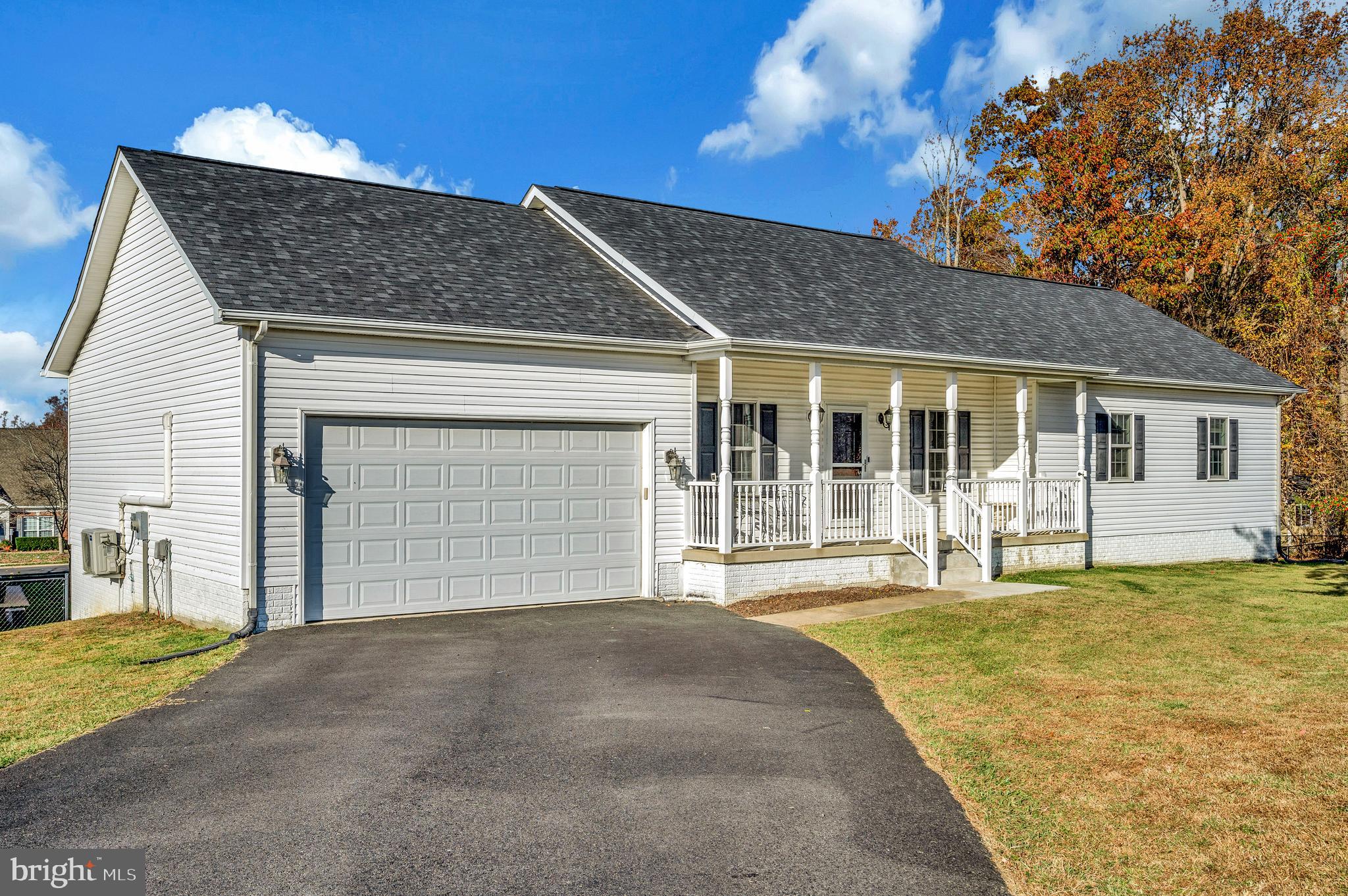 773 Truslow Road Fredericksburg, VA 22406 - Photo 7 of 63 a front view of a house with a yard and garage