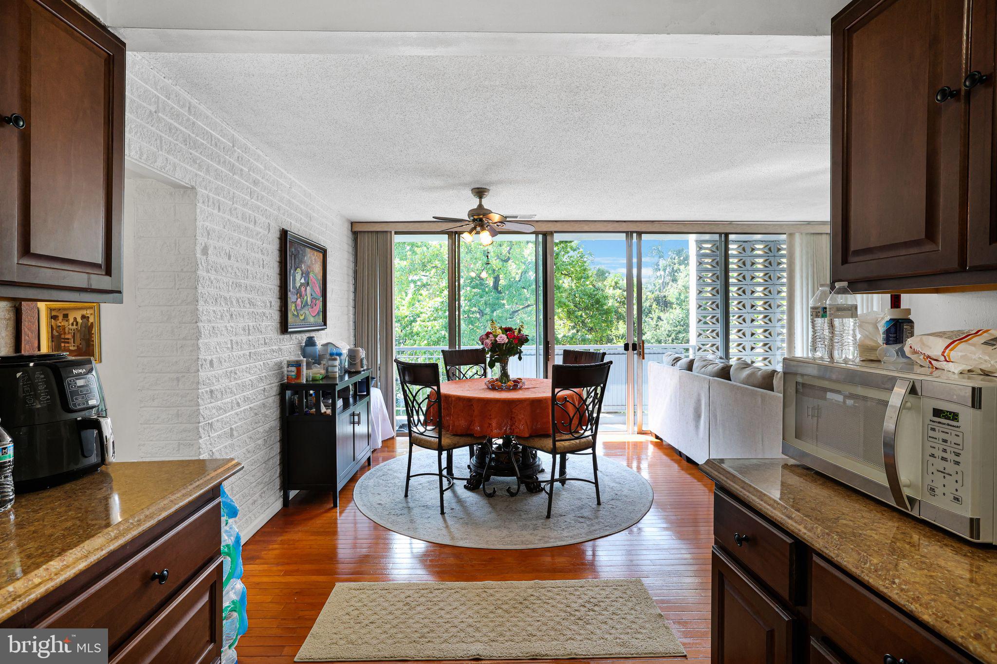 1828 Metzerott Road, Unit 202 Hyattsville, MD 20783 - Photo 6 of 18 a living room with fireplace furniture and a flat screen tv
