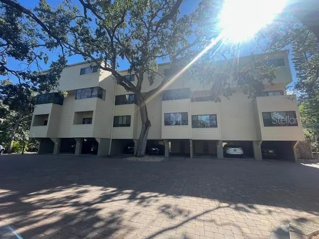 a view of a house with a snow in the forest