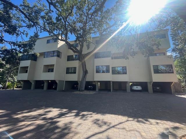 a view of a house with a snow in the forest