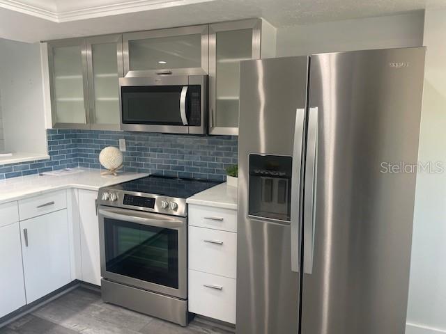 1740 Alderman Street, Unit 7 Sarasota, FL 34236 - Photo 12 of 35 a kitchen with stainless steel appliances granite countertop a refrigerator stove and sink
