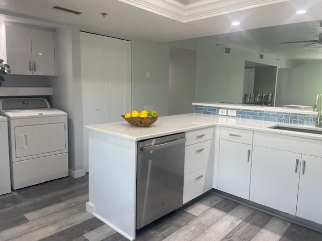 1740 Alderman Street, Unit 7 Sarasota, FL 34236 - Photo 13 of 35 a utility room with cabinets washer and dryer