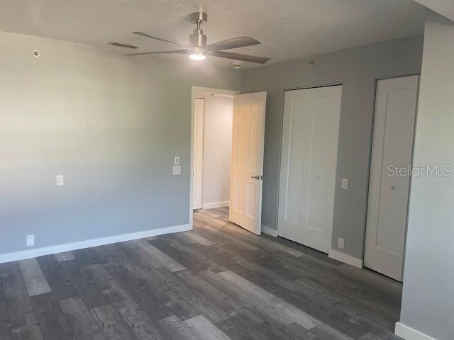 1740 Alderman Street, Unit 7 Sarasota, FL 34236 - Photo 18 of 35 an empty room with wooden floor and fan