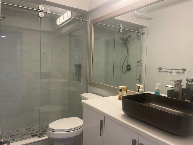 1740 Alderman Street, Unit 7 Sarasota, FL 34236 - Photo 19 of 35 a bathroom with a sink a toilet and shower