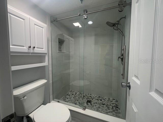 1740 Alderman Street, Unit 7 Sarasota, FL 34236 - Photo 31 of 35 a bathroom with a toilet and a shower