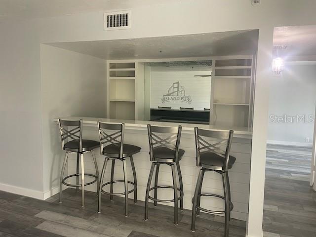 1740 Alderman Street, Unit 7 Sarasota, FL 34236 - Photo 6 of 35 a dining room with furniture and wooden floor