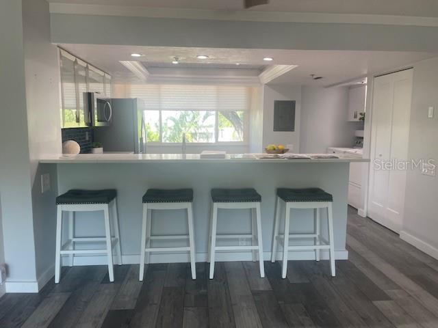 1740 Alderman Street, Unit 7 Sarasota, FL 34236 - Photo 9 of 35 a kitchen with a sink cabinets and wooden floor