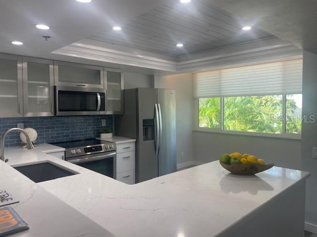 1740 Alderman Street, Unit 7 Sarasota, FL 34236 - Photo 10 of 35 a kitchen with a refrigerator a stove and a sink
