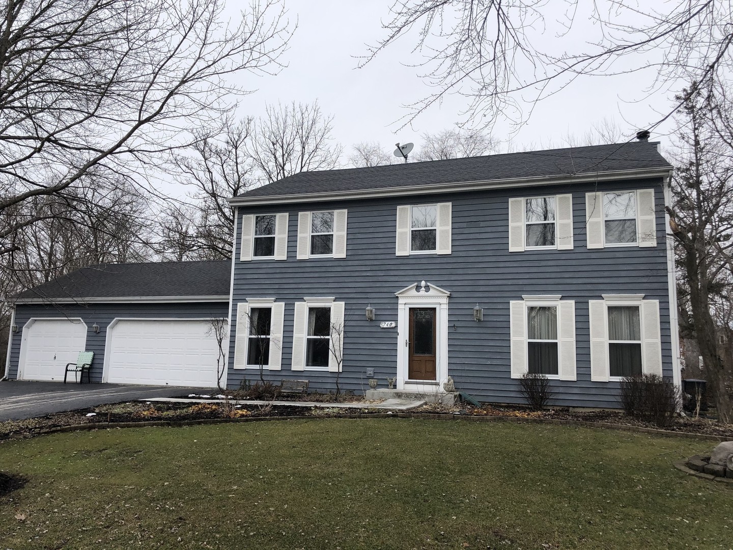 31W740 Russell Road Wayne, IL 60184 - Photo 16 of 20 a front view of a house with a garden
