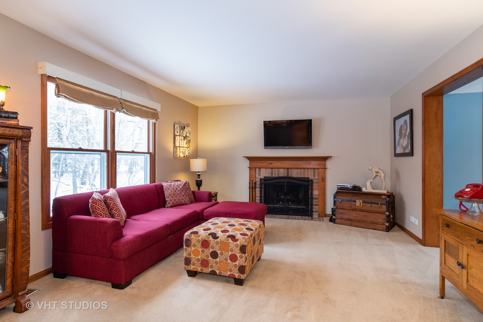 31W740 Russell Road Wayne, IL 60184 - Photo 5 of 20 a living room with furniture a fireplace and a flat screen tv