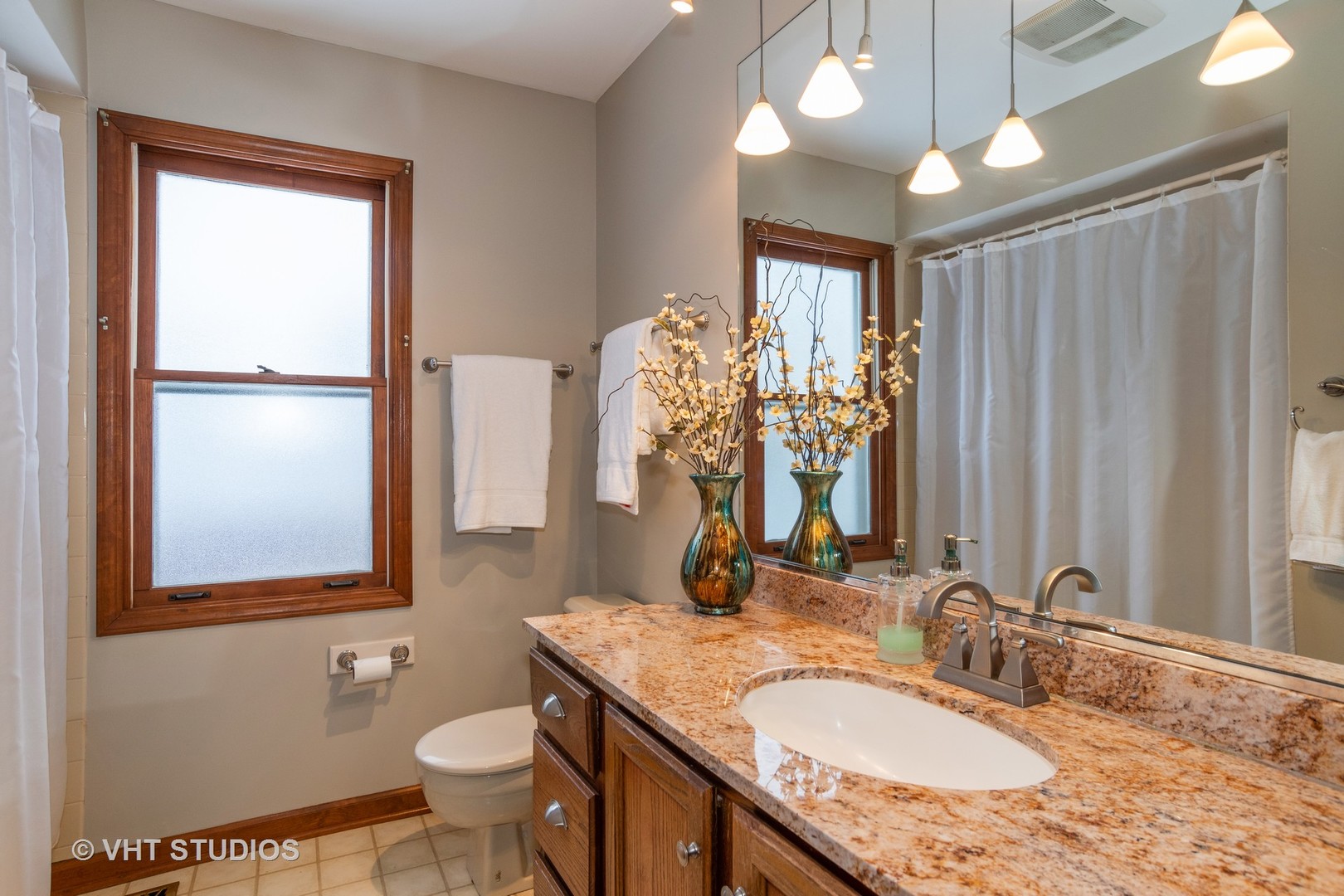 31W740 Russell Road Wayne, IL 60184 - Photo 8 of 20 a bathroom with a granite countertop sink vanity mirror and toilet