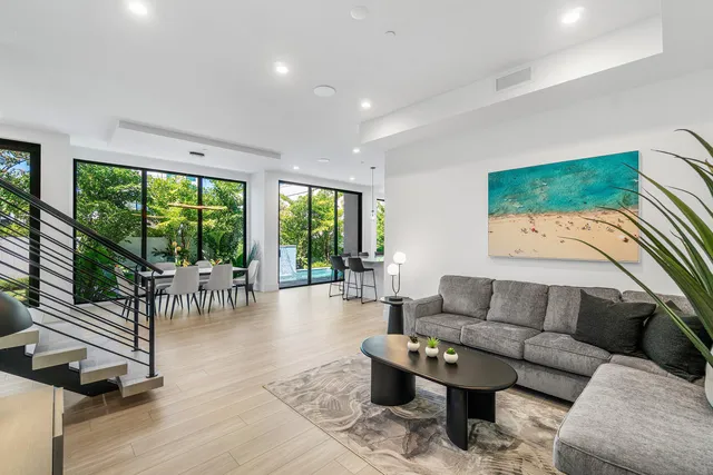 a view of a living room and floor to ceiling window