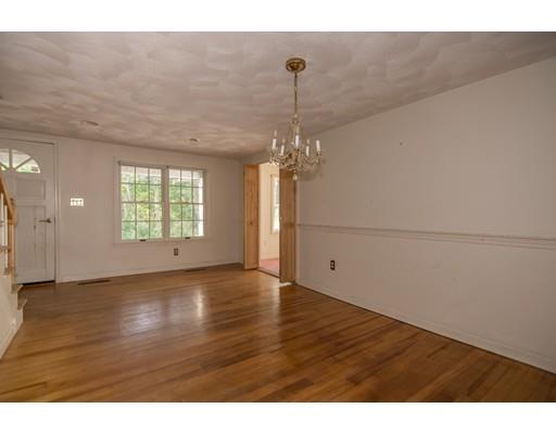 14 Boston Road Andover, MA 01810 - Photo 18 of 40 a view of an empty room with a window and wooden floor