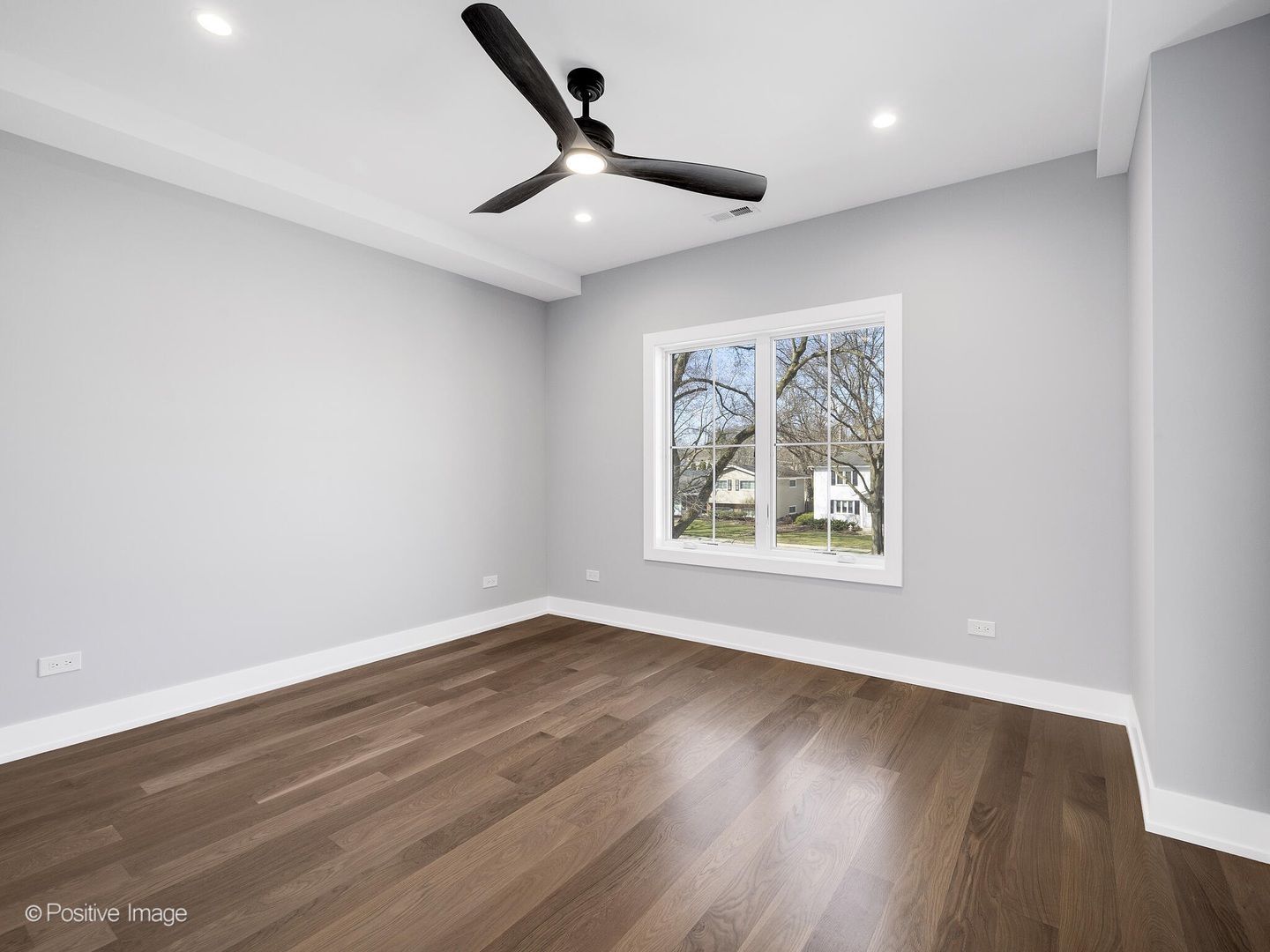 609 North County Line Road Hinsdale, IL 60521 - Photo 18 of 42 a view of an empty room with wooden floor and a window