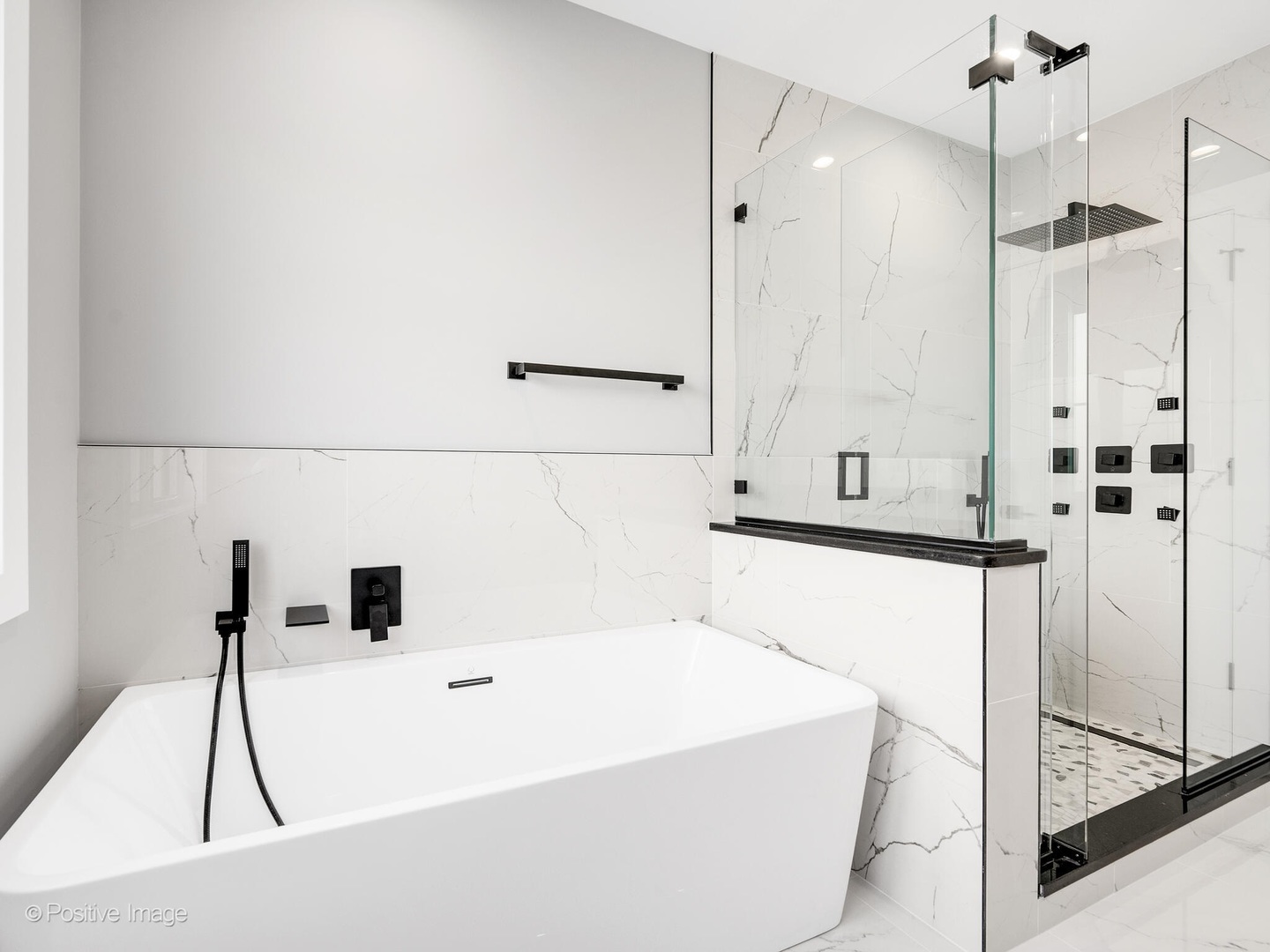 609 North County Line Road Hinsdale, IL 60521 - Photo 22 of 42 a bathroom with a bathtub and a shower