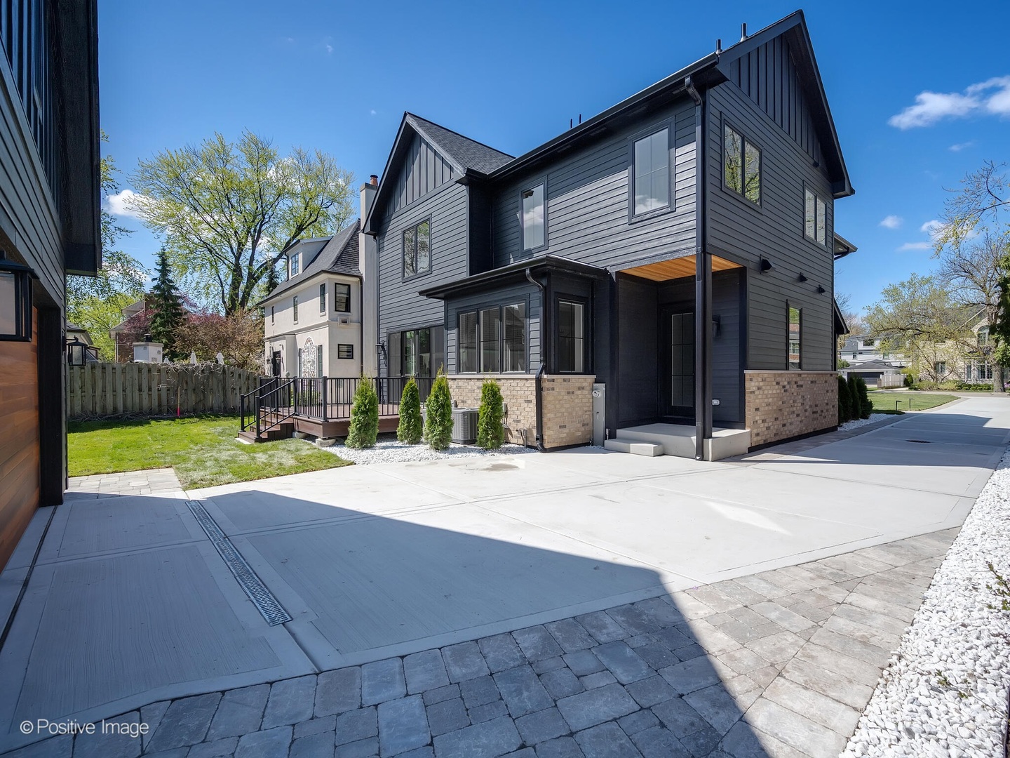 609 North County Line Road Hinsdale, IL 60521 - Photo 35 of 42 a view of a house with a yard and plants