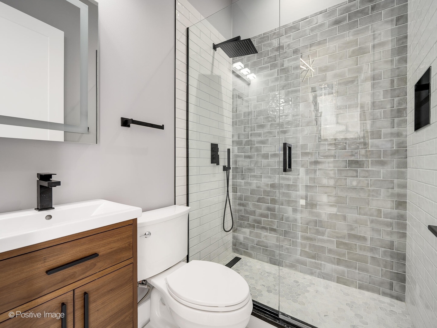 609 North County Line Road Hinsdale, IL 60521 - Photo 5 of 42 a bathroom with a sink a toilet and shower