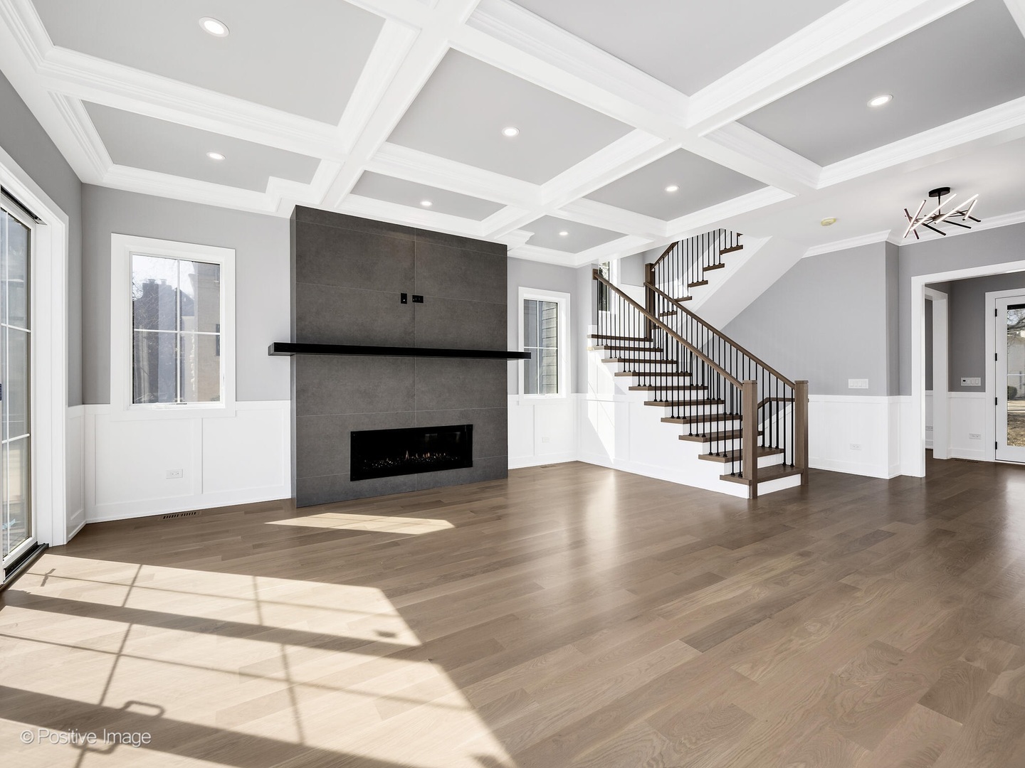 609 North County Line Road Hinsdale, IL 60521 - Photo 10 of 42 a view of an empty room with wooden floor fireplace and a window