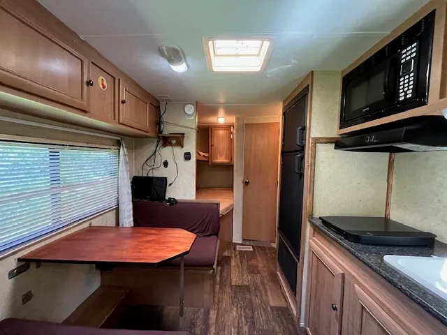 a kitchen with stainless steel appliances granite countertop a stove a sink dishwasher and cabinets
