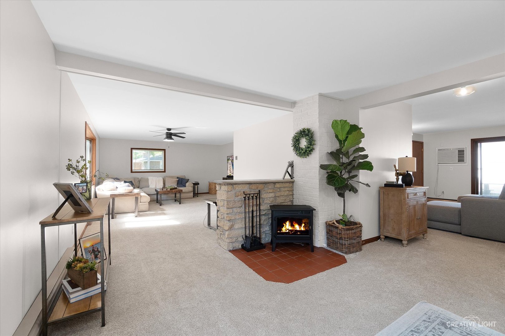 8N510 Thomas Road Hampshire, IL 60140 - Photo 4 of 33 a living room with furniture a fireplace and potted plants