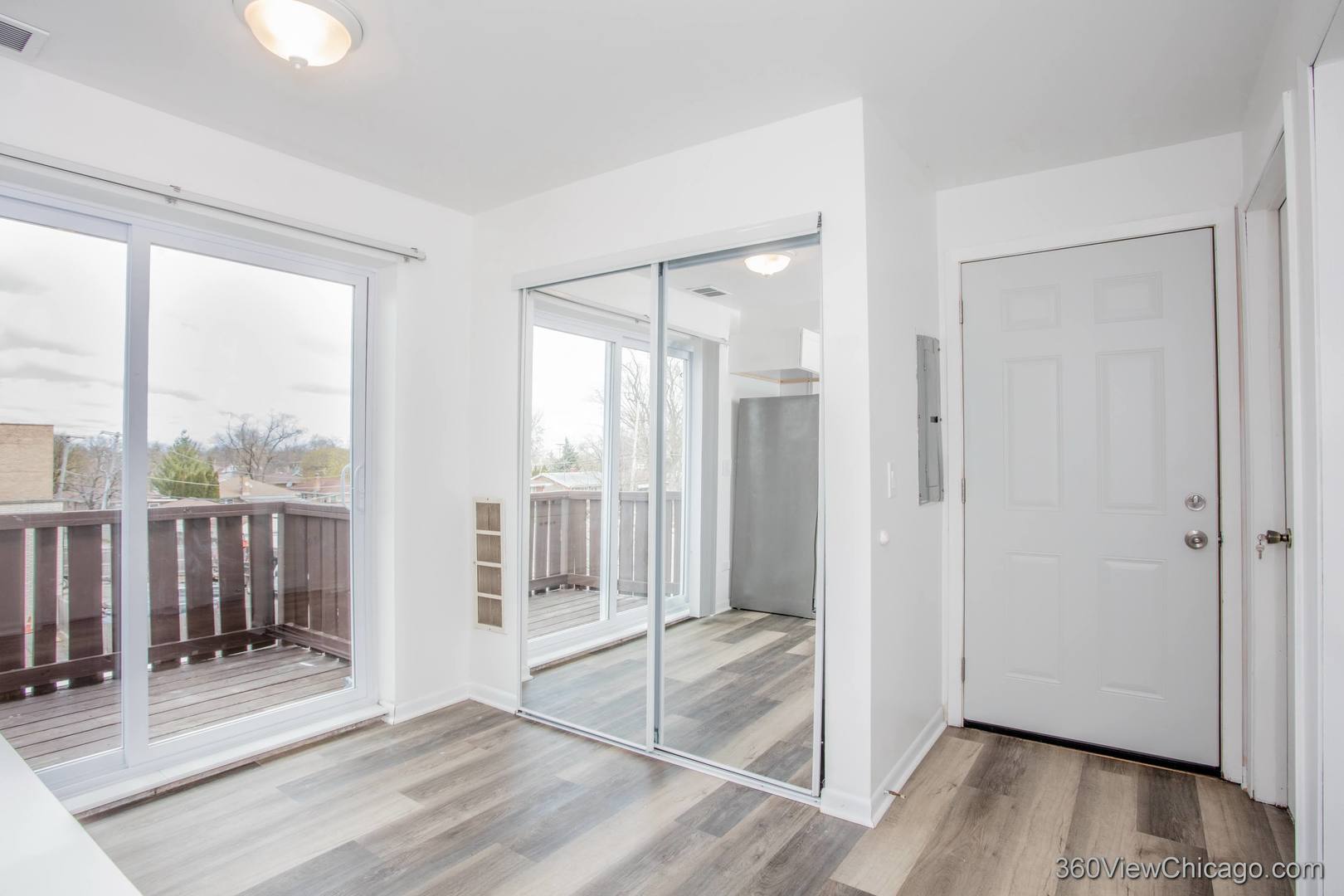 7459 North Waukegan Road, Unit 3 Niles, IL 60714 - Photo 13 of 17 a view of a room with wooden floor and door